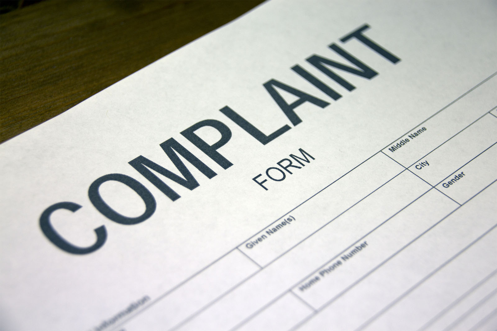 Someone filling out a complaint registration form. (Thinkstock)