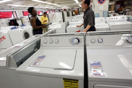 NEW YORK - JULY 18:  Customers look at Maytag and Whirlpool washers and dryers July 18, 2005 in New York City. Whirlpool on Sunday offered to buy Maytag, the maker of Hoover vacuum cleaners and Amana appliances, for $1.3 billion, out-bidding the $1.125 billion pact with private equity firm Ripplewood and possibly sparking a bid war between the companies.  (Photo by Spencer Platt/Getty Images)