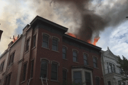 A two-alarm fire started on the roof of a building near 12th and N streets in Northwest at about 4:15 p.m. and the blaze extended into a top floor apartment. (Courtesy D.C. Fire and EMS)