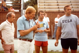Frank Herzog (right) attends Redskins training camp circa 1980. Sonny Jurgensen can be seen in the forefront smoking a cigar. (Courtesy Tom Buckley)