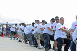 A team at the 2012 plane pull hauls an 80-ton aircraft across the tarmac. (Courtesy Veronica Jennings/Virginia Special Olympics)