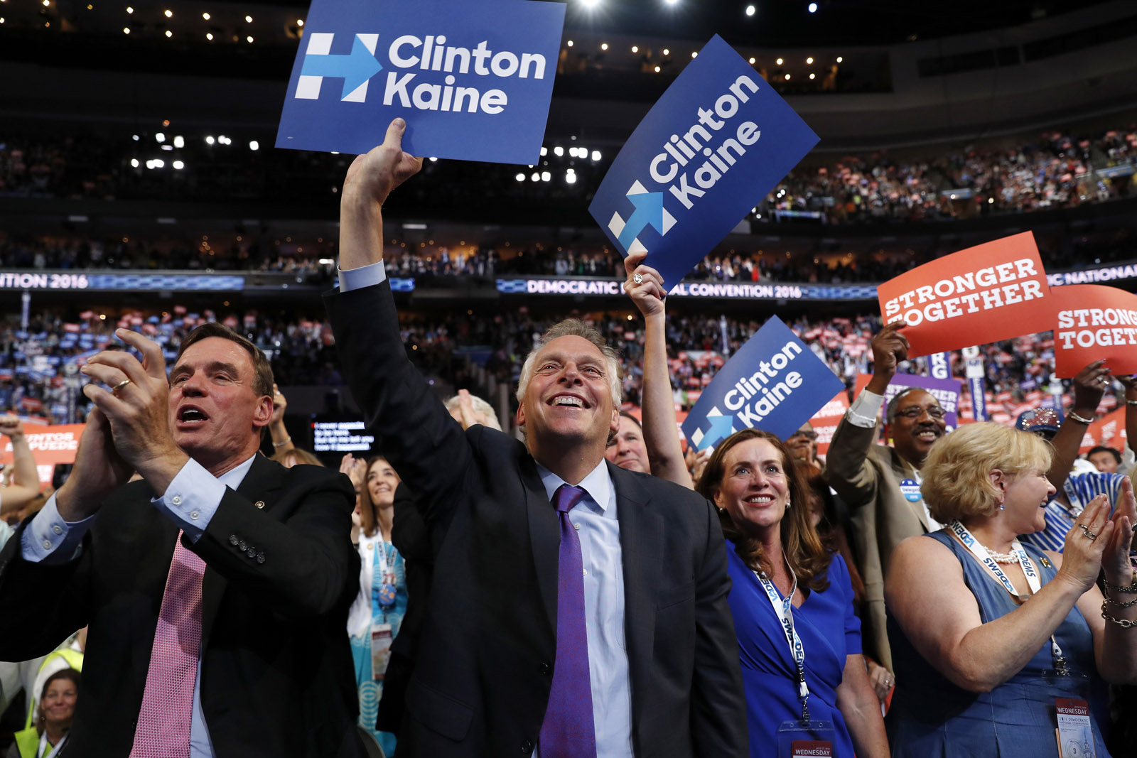 Virginia Gov. Terry McAuliffe and other delegates cheer as Democratic vice presidential candidate, Sen. Tim Kaine, D-Va., speaks during the third day session of the Democratic National Convention in Philadelphia, Wednesday, July 27, 2016. (AP Photo/Carolyn Kaster)