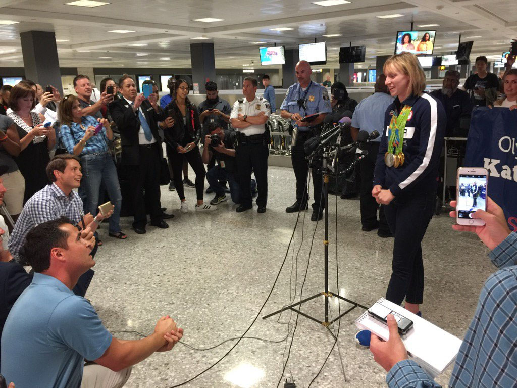 A four-time gold medalist in Rio, swimmer Katie Ledecky addresses the media at Dulles International Airport. (WTOP/Kristi King)
