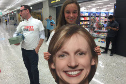 Classmate Alessa Mitchell awaits Katie Ledecky's arrival at Dulles International Airport on Aug. 17. Ledecky returns from Rio with four gold medals and one silver medal. (WTOP/Kristi King)