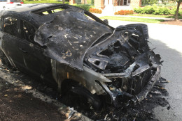 One of the vehicles damaged in a three-car fire in Rockvillle, Maryland. Police don't know if the fire was accidental or intentionally set. (WTOP/Mike Murillo)