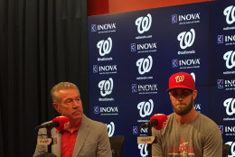 The Nationals' Bryce Harper unveils his new ballcap at Nationals Park. (WTOP/Michelle Basch)