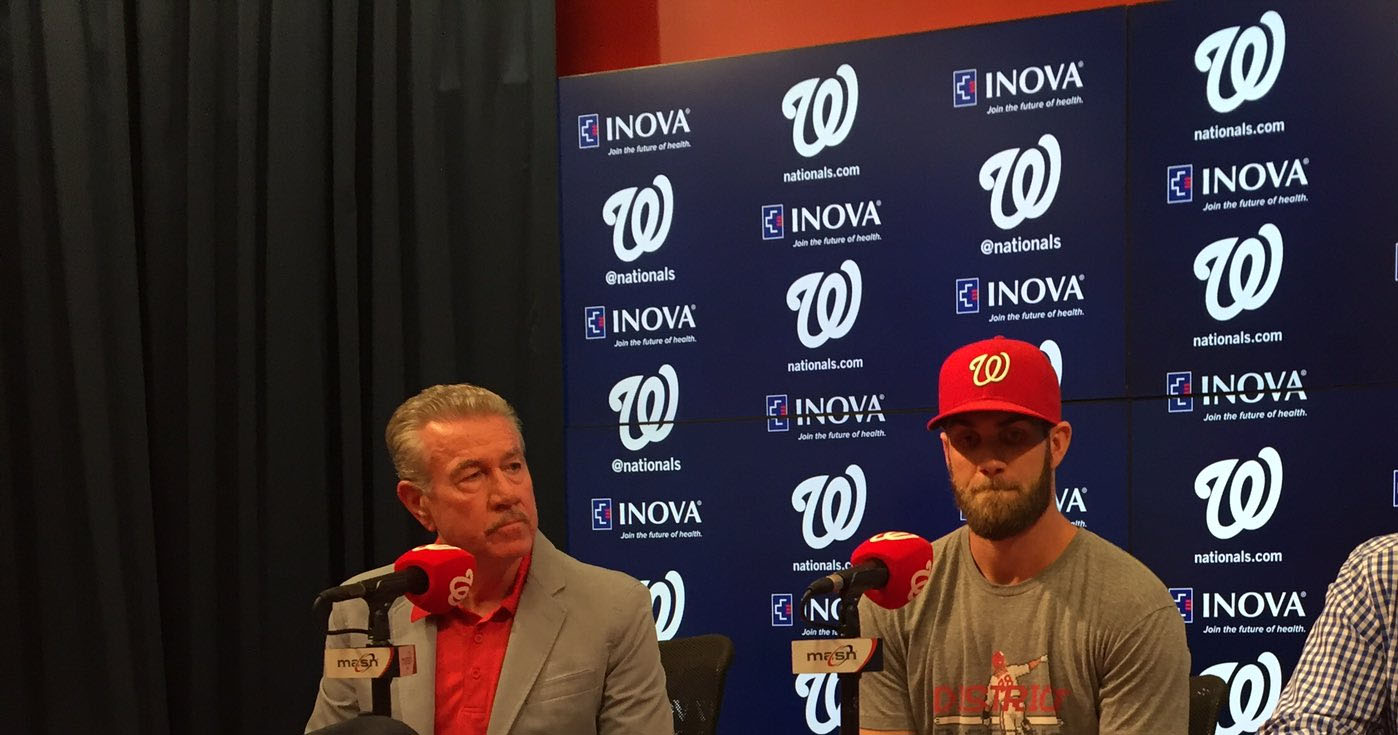 The Nationals' Bryce Harper unveils his new ballcap at Nationals Park. (WTOP/Michelle Basch)