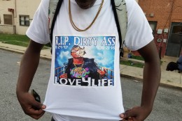Another community member wears a shirt honoring the local rapper. (WTOP/Allison Keyes)