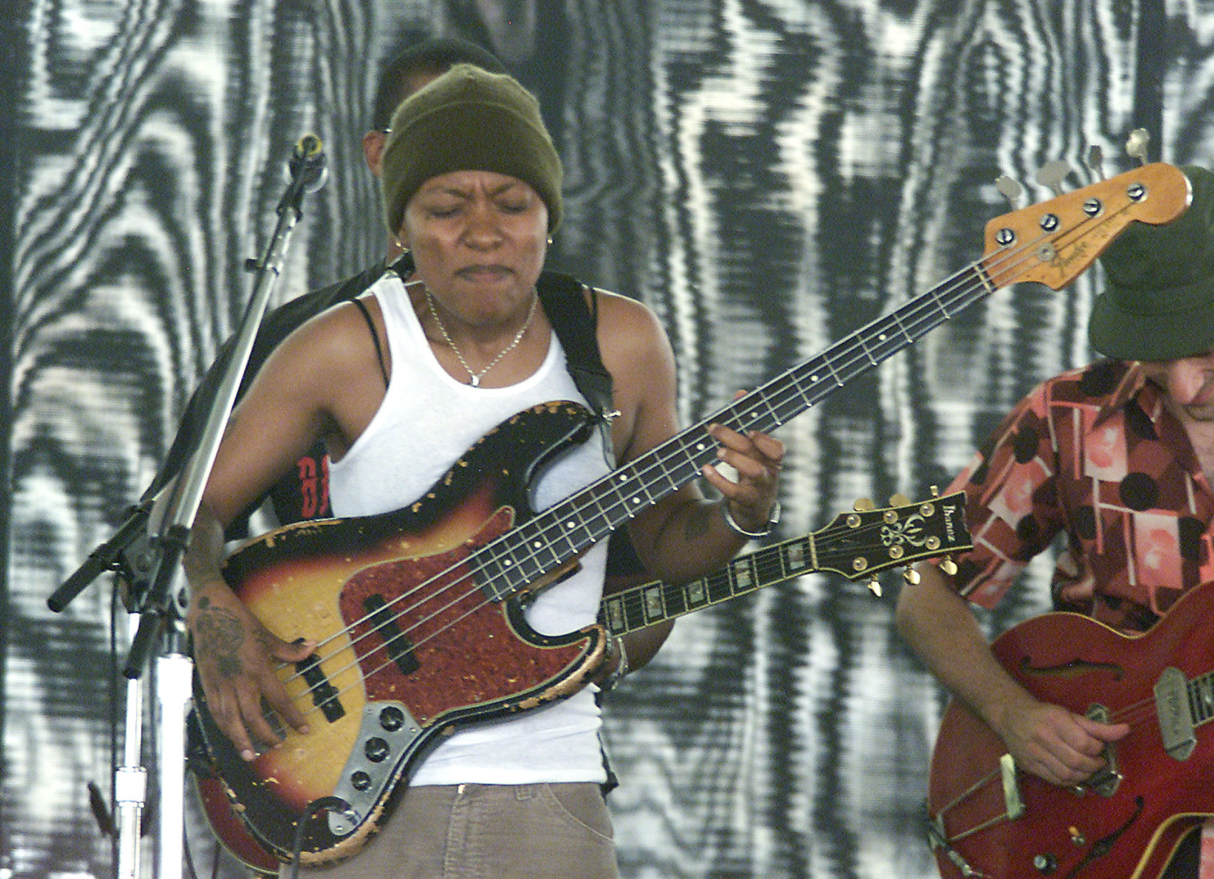 Me'Shell Ndegeocello, lead singer and bass player, performs a set with her band at the JVC Jazz Festival in Newport, R.I., Sunday, Aug. 10, 2003. (AP Photo/Stew Milne)