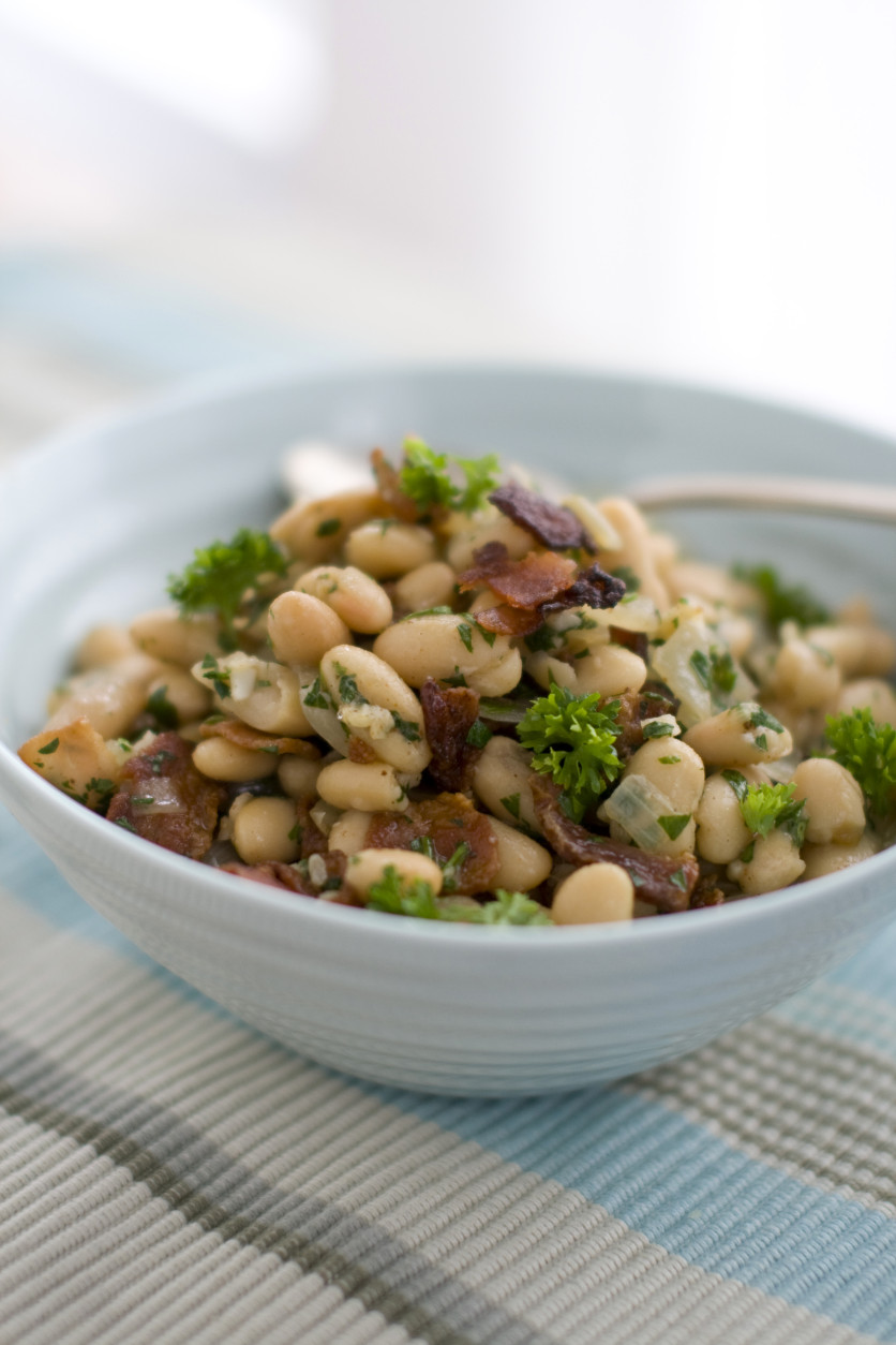 This March 15, 2011 photo shows warm bean and bacon salad in Concord, N.H.  Jacques Pepins salad recipe calls for small white navy beans, but you can substitute any similar variety.   (AP Photo/Matthew Mead)