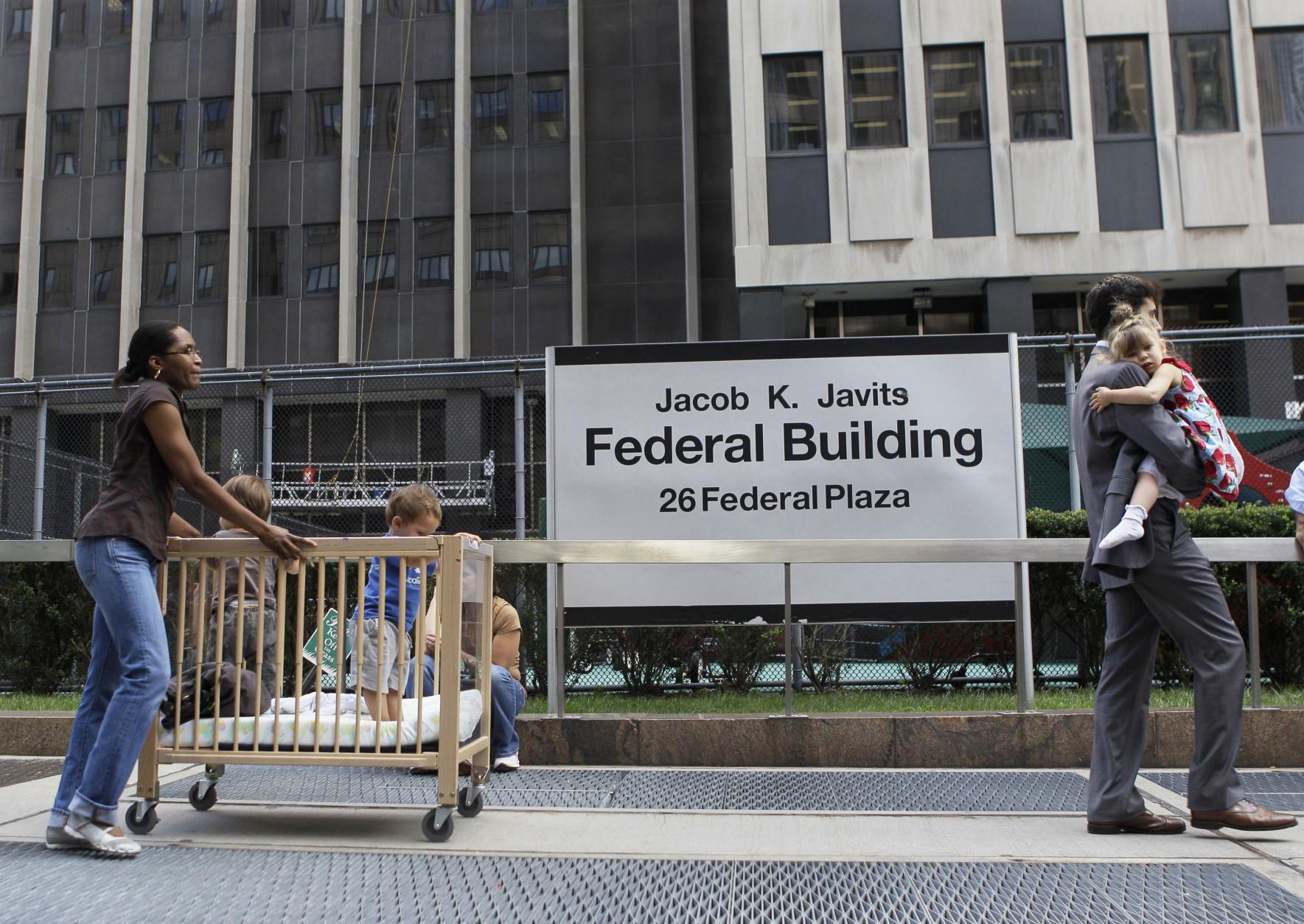 Children are evacuated from the Jacob K. Javits Federal building in New York on Tuesday, Aug. 23, 2011 after an earthquake centered northwest of Richmond, Va. was felt. (AP Photo/Mary Altaffer)