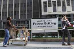 Children are evacuated from the Jacob K. Javits Federal building in New York on Tuesday, Aug. 23, 2011 after an earthquake centered northwest of Richmond, Va. was felt. (AP Photo/Mary Altaffer)