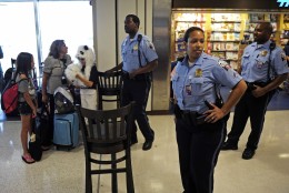 Ronald Reagan National Airport Police stop travelers from entering Terminal A, Tuesday, Aug. 23, 2011, as authorities checked for damage after an earthquake in the Washington area. A 5.9 magnitude earthquake centered in Virginia forced evacuations of all the monuments on the National Mall in Washington and rattled nerves from Georgia to Martha's Vineyard, the Massachusetts island where President Barack Obama is vacationing. No injuries were immediately reported.  (AP Photo/Cliff Owen)