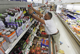 Store owner B. J. Singh, replaces bottles on shelves Miller's Mart food store in Mineral, Va., a small town northwest of Richmond near the epicenter of an earthquake that struck Tuesday, Aug. 23, 2011. The most powerful earthquake to strike the East Coast in 67 years shook buildings and rattled nerves from South Carolina to Maine. (AP Photo/Steve Helber)