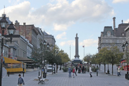 This Oct. 22, 2013 photo shows Place Jacques-Cartier in Old Montreal. Visitors can stroll the neighborhood for a feel of the citys French and English cultures. (AP Photo/Caryn  Rousseau)
