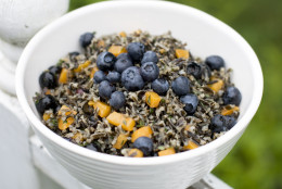 This July 22, 2013 photo shows a recipe for herbed wild rice salad with apricots and blueberries. (AP Photo/Matthew Mead)