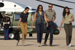 Malia Obama, left, first lady Michelle Obama, President Barack Obama, and Sasha Obama walk to board Air Force One in Roswell, N.M., after visiting Carlsbad Caverns National Park, on Friday, June 17, 2016. The Obama family traveled to Carlsbad Caverns National Park to celebrate the 100th anniversary of the creation of America's national park system, and now continue onto Yosemite. (AP Photo/Jacquelyn Martin)