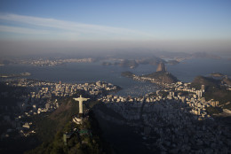 The Sugar loaf and Guanabara bay are seen behind the Christ the Redeemer statue in Rio de Janeiro, Brazil, Monday, July 4, 2016. With the Olympics set to start on Aug. 5, the games and the city have been overshadowed by security threats, violence, the Zika virus and a national political corruption scandal. (AP Photo/Felipe Dana)