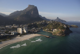 The Barra da Tijuca beach is seen from the air, in Rio de Janeiro, Brazil, Monday, July 4, 2016. With the Olympics set to start on Aug. 5, the games and the city have been overshadowed by security threats, violence, the Zika virus and a national political corruption scandal. (AP Photo/Felipe Dana)