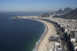The Olympic beach volleyball venue continues under construction on Copacabana beach in Rio de Janeiro, Brazil, Tuesday, July 5, 2016. With the Olympics set to start on Aug. 5, the games and the city have been overshadowed by security threats, violence, the Zika virus and a national political corruption scandal. (AP Photo/Felipe Dana)