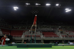 China's gymnast You Hao trains on the parallel bars ahead of the 2016 Summer Olympics in Rio de Janeiro, Brazil, Wednesday, Aug. 3, 2016. (AP Photo/Julio Cortez)