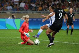 New Zealand goalkeeper Erin Nayler, left, and Amber Hearn watch the ball as United States' Carli Lloyd, center, tries to score during a women's Olympic football tournament match at the Mineirao stadium in Belo Horizonte, Brazil, Wednesday, Aug. 3, 2016. United States won 2-0. (AP Photo/Eugenio Savio)