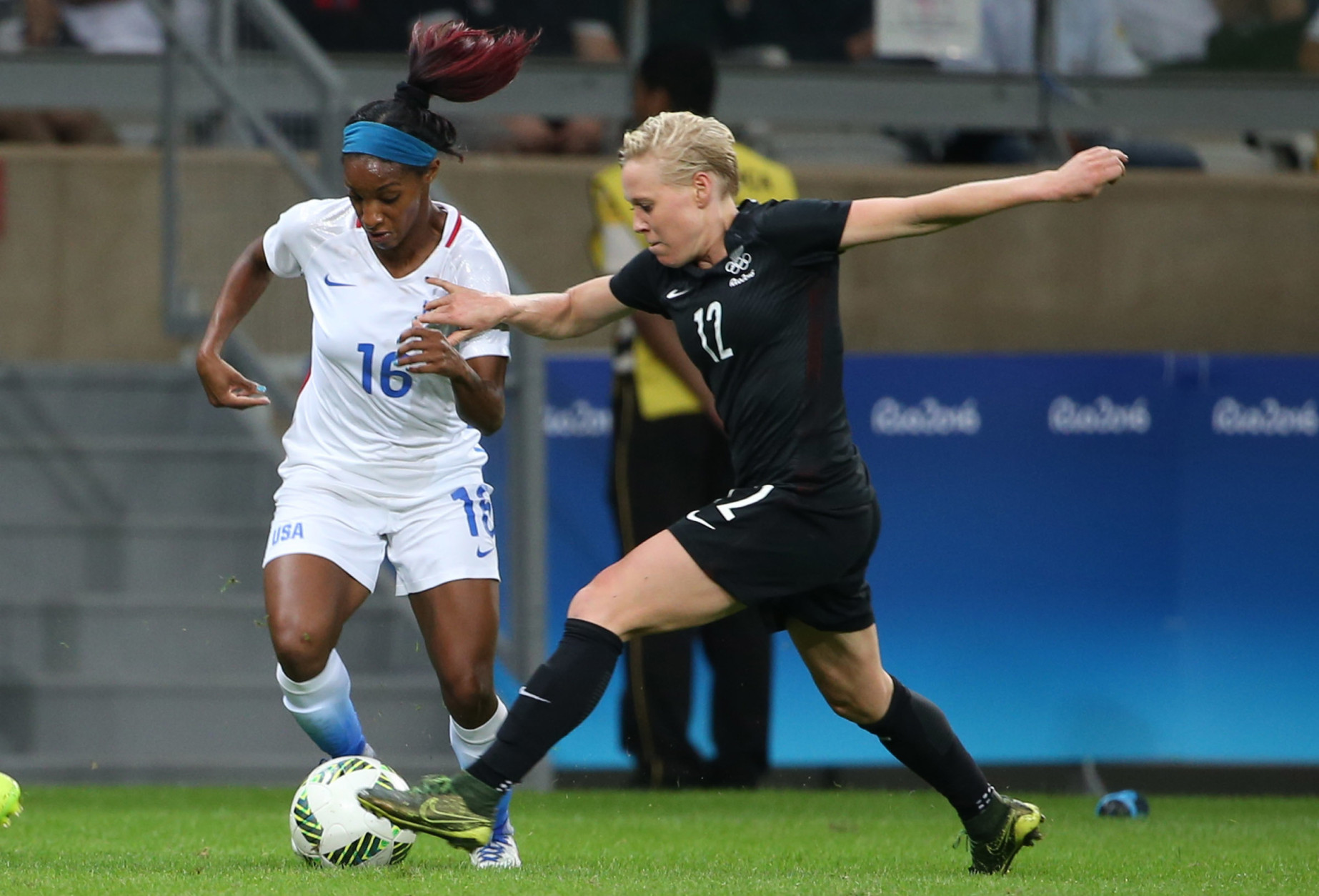 United States' Crystal Dunn, left, and New Zealand's Betsy Hassett vie for the ball during a women's Olympic football tournament match at the Mineirao stadium in Belo Horizonte, Brazil, Wednesday, Aug. 3, 2016. United States won 2-0. (AP Photo/Eugenio Savio)