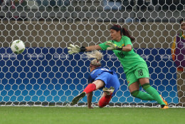 France's Eugenie Le Sommer, bottom, scores a goal past Colombia goalkeeper Catalina Perez during the Women's Olympic Football Tournament at the Mineirao stadium in Belo Horizonte, Brazil, Wednesday, Aug. 3, 2016. (AP Photo/Eugenio Savio)