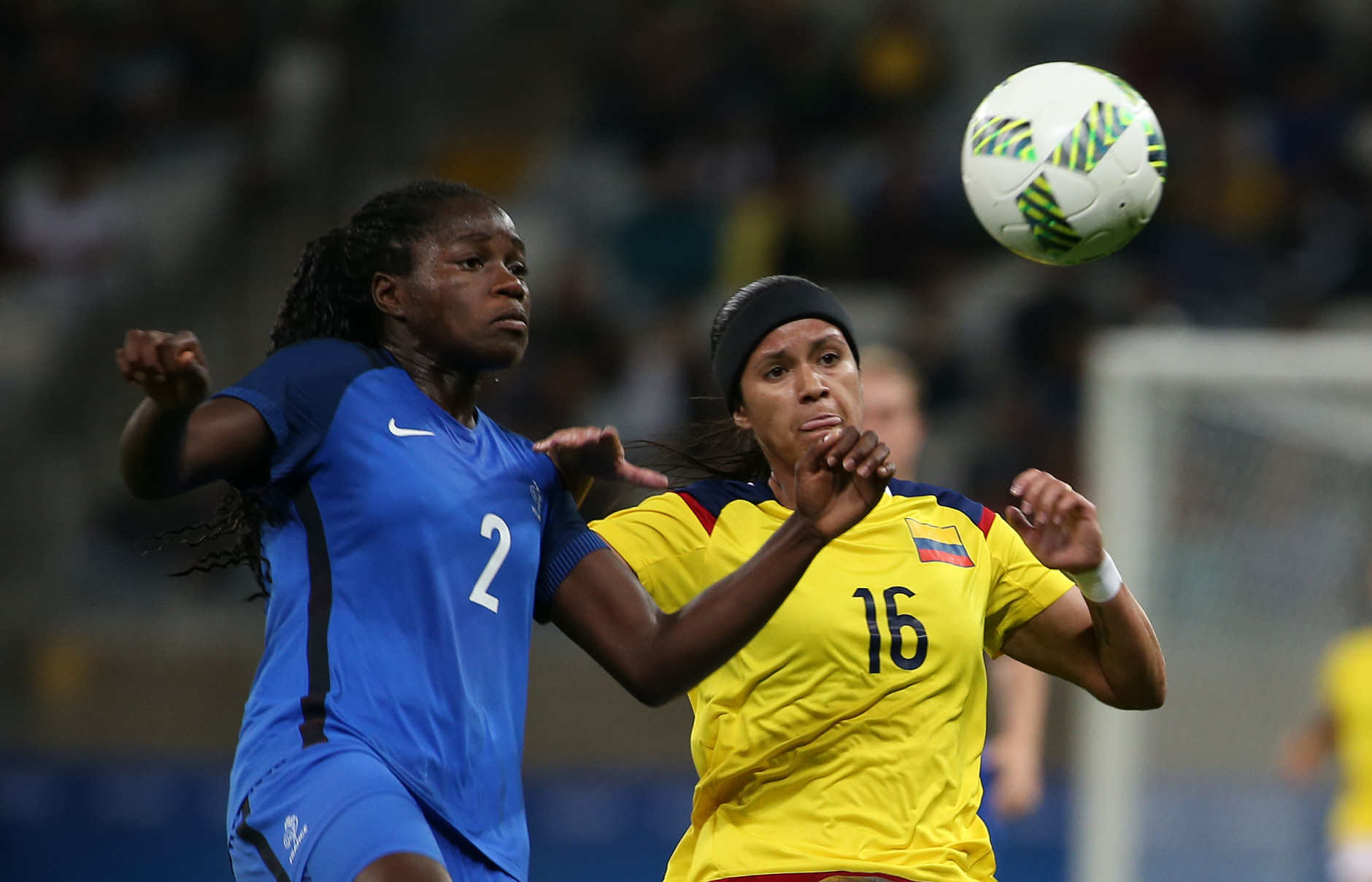 France's Griedge Mbock Bathy, left, fights for the ball with Colombia's Lady Andrade during the Women's Olympic Football Tournament at the Mineirao stadium in Belo Horizonte, Brazil, Wednesday, Aug. 3, 2016. (AP Photo/Eugenio Savio)