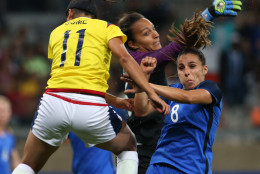 Colombia's Catalina Usme, left, France goalkeeper Sarah Bouhaddi, center, and France's Jessica Houara fight for the ball during the Women's Olympic Football Tournament at the Mineirao stadium in Belo Horizonte, Brazil, Wednesday, Aug. 3, 2016. (AP Photo/Eugenio Savio)