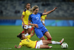 France's Claire Lavogez, top, fights for the ball with Colombia's Carolina Arias during the Women's Olympic Football Tournament at the Mineirao stadium in Belo Horizonte, Brazil, Wednesday, Aug. 3, 2016. France won 4-0. (AP Photo/Eugenio Savio)