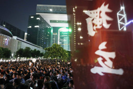 Protesters attend a rally outside the Hong Kong government headquarters, Friday, Aug. 5, 2016 as they demand Hong Kong Independence. Amid a dispute over candidates excluded on political grounds, Hong Kong's government on Friday posted the names of those approved to run in the territory's most contentious Legislative Council elections since reverting to Chinese rule almost two decades ago. The banner reads "Independence". (AP Photo/Kin Cheung)