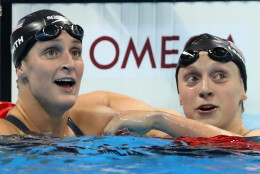 United States' Katie Ledecky, right, looks up with United States' Leah Smith after winning the gold medal in the women's 400-meter freestyle setting a new world record during the swimming competitions at the 2016 Summer Olympics, Sunday, Aug. 7, 2016, in Rio de Janeiro, Brazil. (AP Photo/Lee Jin-man)