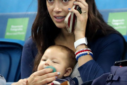 Nicole Johnson, fiance of United States' Michael Phelps, holds their baby Boomer during the swimming competitions at the 2016 Summer Olympics, Monday, Aug. 8, 2016, in Rio de Janeiro, Brazil. (AP Photo/Lee Jin-man)