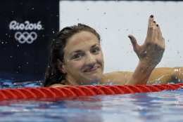 Hungary's Katinka Hosszu celebrates after winning the gold medal in the women's 100-meter backstroke final during the swimming competitions at the 2016 Summer Olympics, Monday, Aug. 8, 2016, in Rio de Janeiro, Brazil. (AP Photo/Michael Sohn)