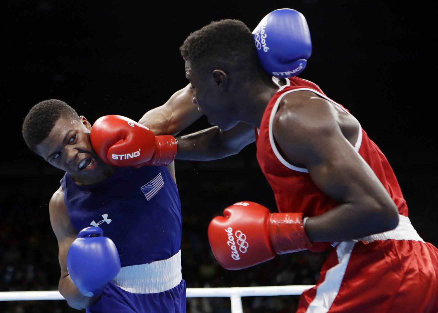 United State's Gary Russell, left, fights Haiti's Haiti's Richardson Hitchins during a men's light welterweight 64-kg preliminary boxing match at the 2016 Summer Olympics in Rio de Janeiro, Brazil, Wednesday, Aug. 10, 2016. (AP Photo/Frank Franklin II)