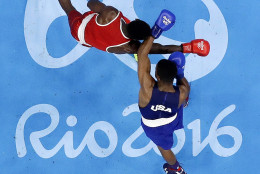 United State's Gary Russell, right, fights Haiti's Haiti's Richardson Hitchins during a men's light welterweight 64-kg preliminary boxing match at the 2016 Summer Olympics in Rio de Janeiro, Brazil, Wednesday, Aug. 10, 2016. (AP Photo/Frank Franklin II)
