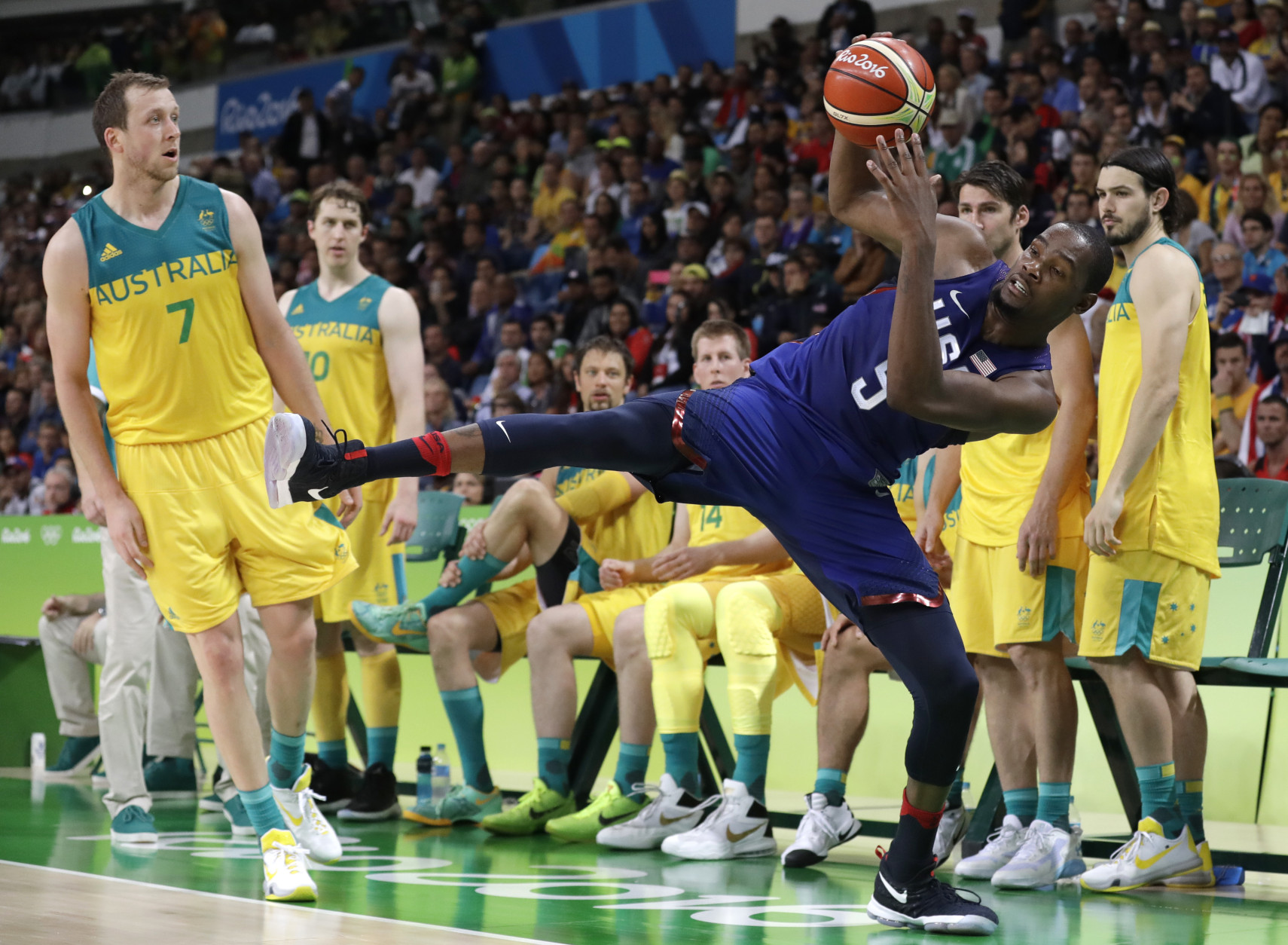 United States' Kevin Durant (5) is fouled by Australia's Joe Ingles (7) during a basketball game at the 2016 Summer Olympics in Rio de Janeiro, Brazil, Wednesday, Aug. 10, 2016. (AP Photo/Charlie Neibergall)