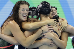 United States' Katie Ledecky, second from right, celebrates with her teammates Allison Schmitt, Maya DiRado and Leah Smith, from left, after coming in first in the women's 4 x 200-meter freestyle relay final during the swimming competitions at the 2016 Summer Olympics, Thursday, Aug. 11, 2016, in Rio de Janeiro, Brazil. (AP Photo/Michael Sohn)