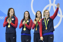United States' Allison Schmitt, Leah Smith, Maya DiRado and Katie Ledecky, from left, celebrate their gold medals during the women's 4 x 200-meter freestyle relay medals ceremony at the swimming competitions at the 2016 Summer Olympics, Thursday, Aug. 11, 2016, in Rio de Janeiro, Brazil. (AP Photo/Martin Meissner)