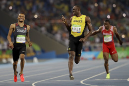 Jamaica's Usain Bolt, center, and Canada's Andre De Grasse, left, compete in a men's 200-meter semifinal during the athletics competitions of the 2016 Summer Olympics at the Olympic stadium in Rio de Janeiro, Brazil, Wednesday, Aug. 17, 2016. (AP Photo/David J. Phillip)