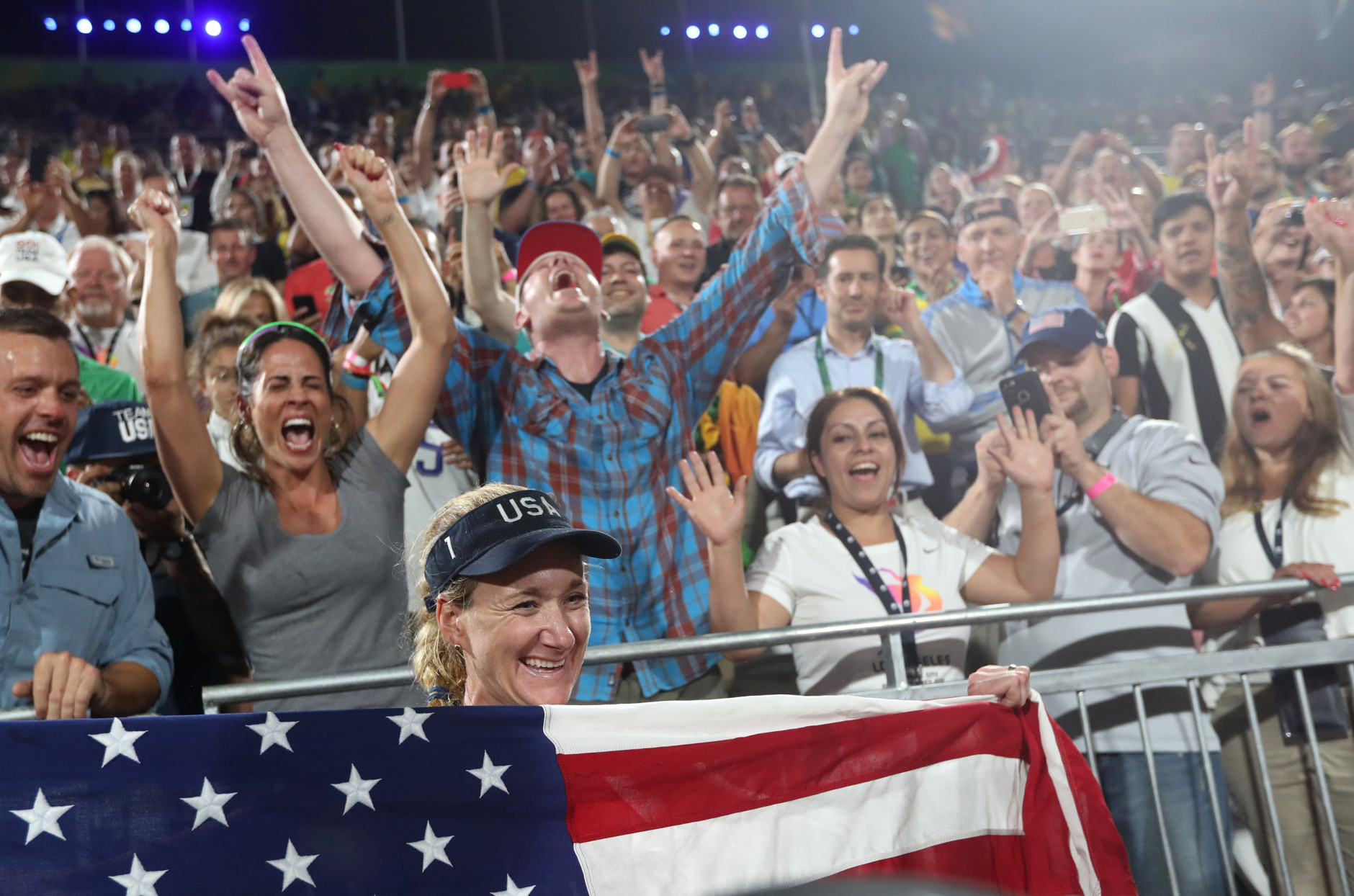 United States' Kerri Walsh Jennings celebrates with fans after defeating Brazil in a women's beach volleyball bronze medal match at the 2016 Summer Olympics in Rio de Janeiro, Brazil, Wednesday, Aug. 17, 2016. (AP Photo/Petr David Josek)
