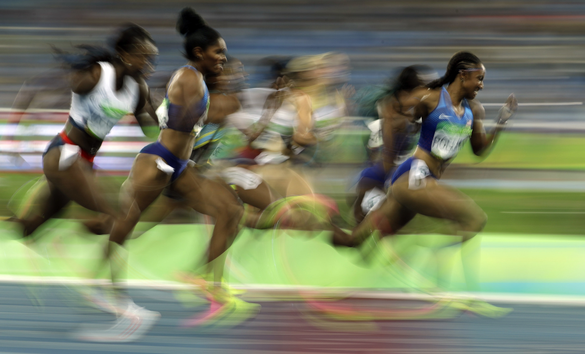 United States' Brianna Rollins, right, competes in the women's 100-meter hurdles final during the athletics competitions of the 2016 Summer Olympics at the Olympic stadium in Rio de Janeiro, Brazil, Wednesday, Aug. 17, 2016. (AP Photo/Charlie Riedel)