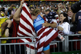 United States' Helen Louise Maroulis, centre, celebrates with fans after winning the gold medal during the women's 53-kg freestyle wrestling competition at the 2016 Summer Olympics in Rio de Janeiro, Brazil, Thursday, Aug. 18, 2016. (AP Photo/Markus Schreiber)
