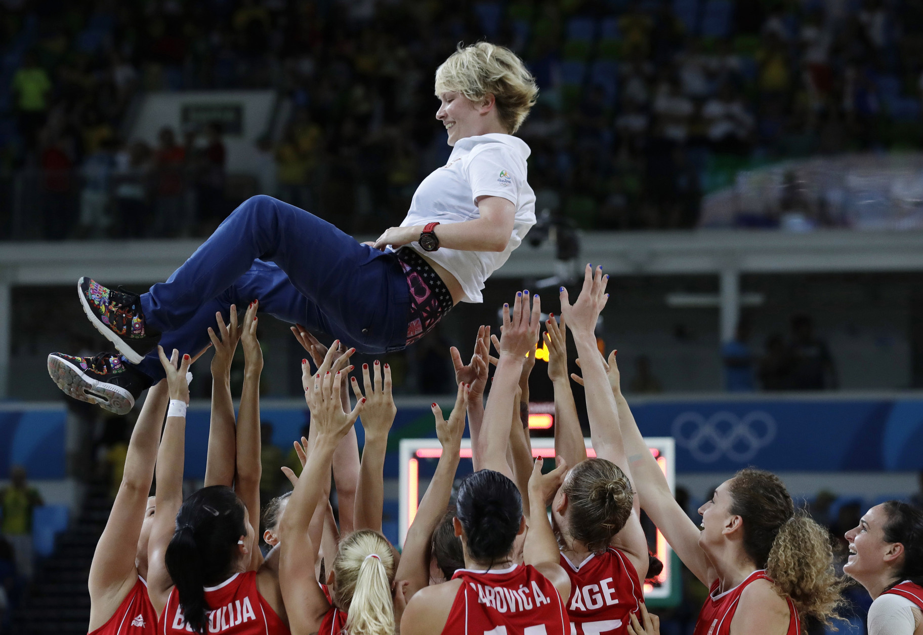 Serbia head coach Marina Maljkovic is tossed in the air by her players after they defeated France in the women's bronze medal basketball game at the 2016 Summer Olympics in Rio de Janeiro, Brazil, Saturday, Aug. 20, 2016. (AP Photo/Eric Gay)