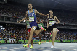 United States' Matthew Centrowitz crosses the line to win gold in the men's 1500-meter final during the athletics competitions of the 2016 Summer Olympics at the Olympic stadium in Rio de Janeiro, Brazil, Saturday, Aug. 20, 2016. (AP Photo/Matt Slocum)