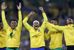 Brazil's Neymar, center, celebrates with teammates during the medal ceremony after the final match of the men's Olympic football tournament between Brazil and Germany at the Maracana stadium in Rio de Janeiro, Brazil, Saturday, Aug. 20, 2016. Brazil won the gold medal on a penalty shootout. (AP Photo/Andre Penner)