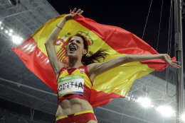 Spain's Ruth Beitia celebrates winning the gold medal in the women's high jump during the athletics competitions of the 2016 Summer Olympics at the Olympic stadium in Rio de Janeiro, Brazil, Saturday, Aug. 20, 2016. (AP Photo/Charlie Riedel)