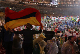 A man waves Colombia's flag during the closing ceremony for the Summer Olympics inside Maracana stadium in Rio de Janeiro, Brazil, Sunday, Aug. 21, 2016. (AP Photo/Jae C. Hong)