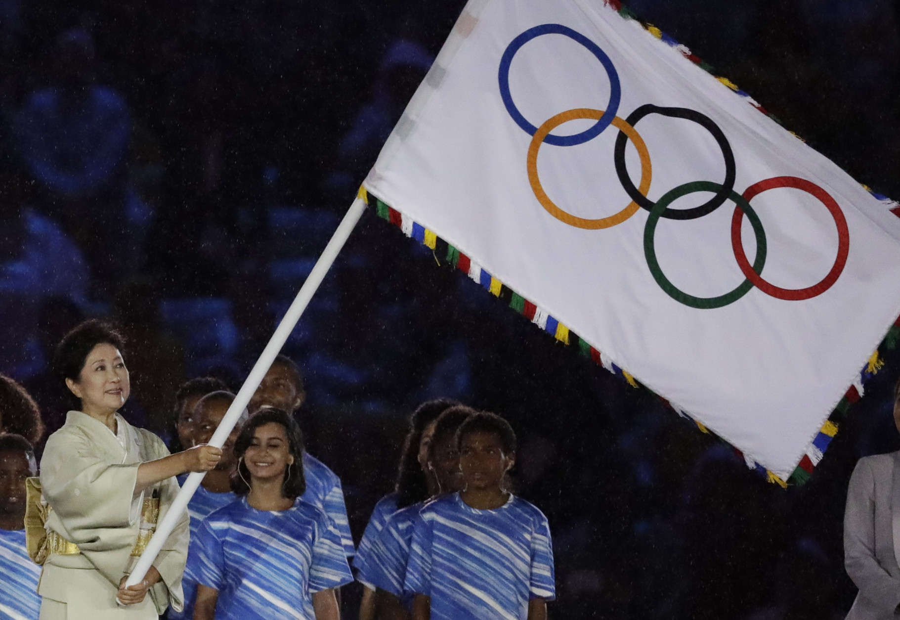 Tokyo governor Yuriko Koike waves the Olympic flag during the closing ceremony in the Maracana stadium at the 2016 Summer Olympics in Rio de Janeiro, Brazil, Sunday, Aug. 21, 2016. (AP Photo/Matt Dunham)
